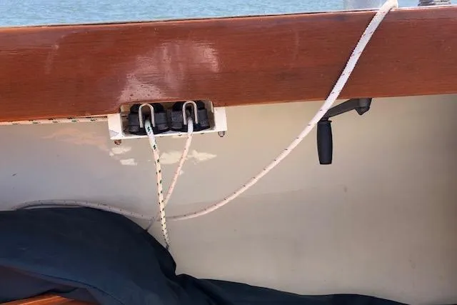Slide: The Image of 1963 Cape Cod Shipbuilding Shields sailboat interior with ropes and wooden trim. - 10