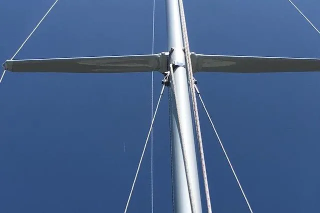 Slide: The Image of Mast of 1963 Cape Cod Shipbuilding Shields sailboat against clear blue sky. - 12
