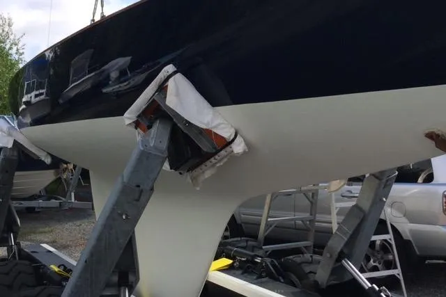 Slide: The Image of 1963 Cape Cod Shipbuilding Shields sailboat hull on stands in a boatyard. - 20