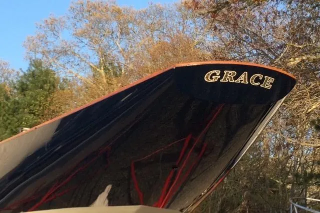 Slide: The Image of 1963 Cape Cod Shipbuilding Shields sailboat named "Grace" with autumn trees in background. - 22