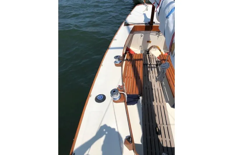 Slide: The Image of 1963 Cape Cod Shipbuilding Shields sailboat deck with wooden seating and winches. - 29