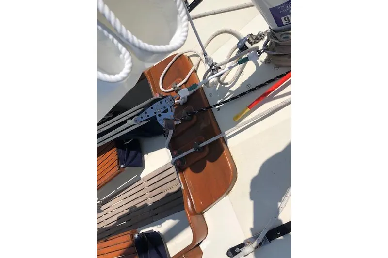 Slide: The Image of 1963 Cape Cod Shipbuilding Shields sailboat deck with rigging and wooden details. - 30