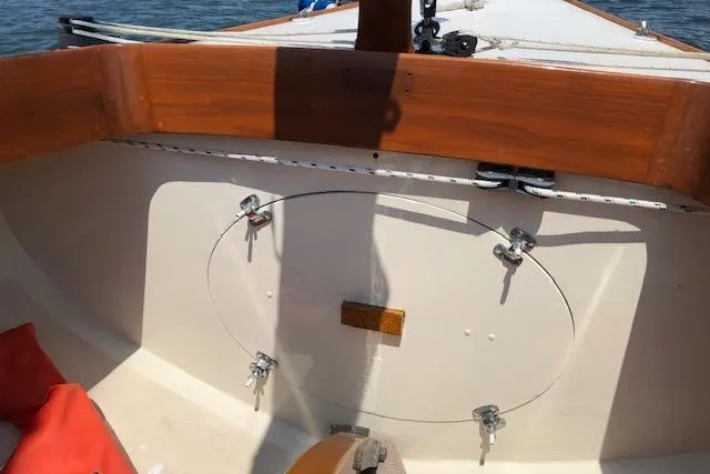 Slide: The Image of 1963 Cape Cod Shipbuilding Shields sailboat cockpit with wooden trim and nautical equipment. - 8