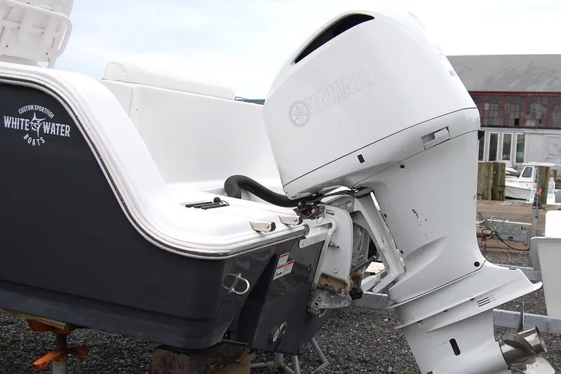 Slide: The Image of 2023 Sportsman Open 242 Center Console with Yamaha outboard motor at dock. - 4