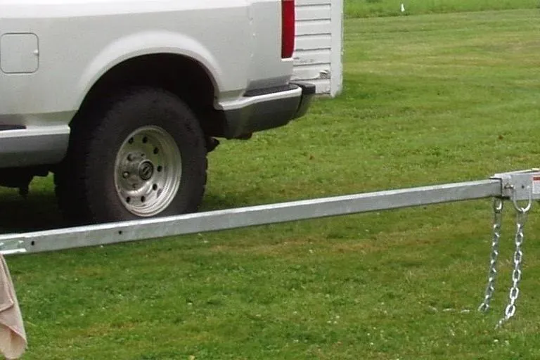 Slide: The Image of White truck with trailer hitch on grassy field, Edey & Duff Doughdish, 1981. - 5