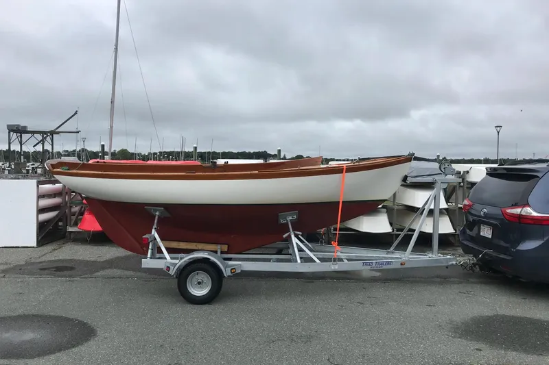 Slide: The Image of 1981 Edey & Duff Doughdish sailboat on trailer, parked near waterfront. - 6