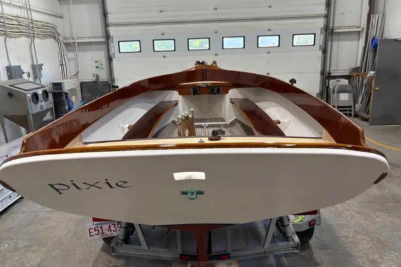 Slide: The Image of 1981 Edey & Duff Doughdish sailboat "Pixie" in a workshop, Massachusetts trailer visible. - 8