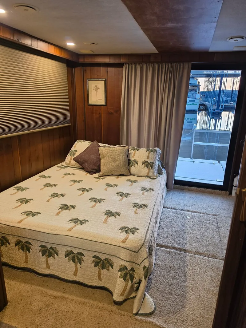 The Image of Bedroom in 1994 Gibson 47 Executive yacht with palm tree bedding. - 0