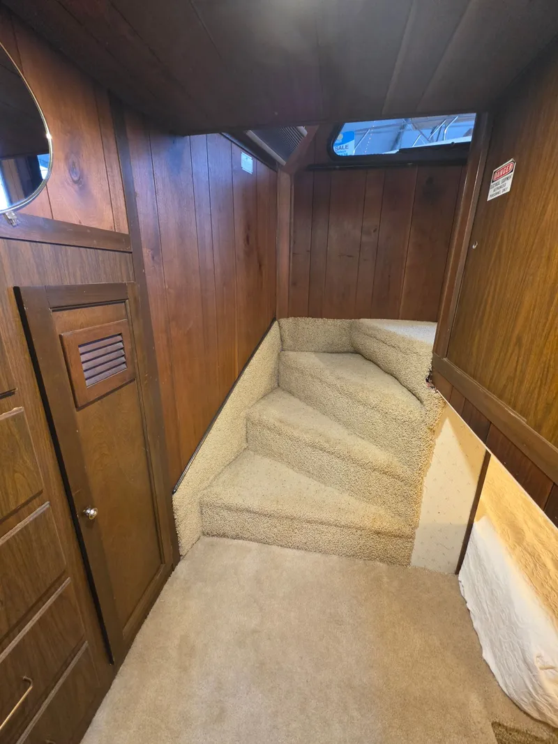 Slide: The Image of Interior of a 1994 Gibson 47 Executive yacht with carpeted stairs. - 10