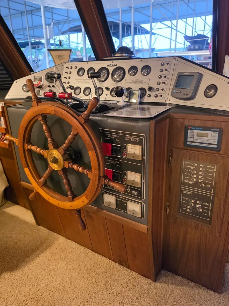 Slide: The Image of 1994 Gibson 47 Executive helm with wooden steering wheel. - 13