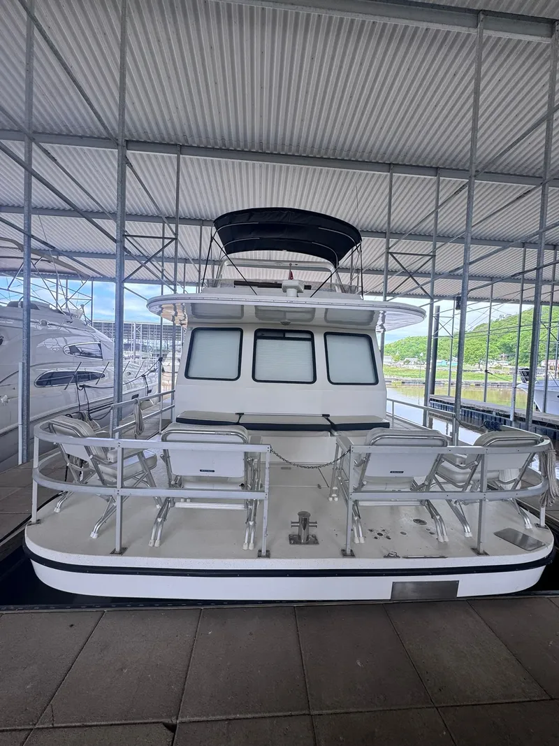 Slide: The Image of 1994 Gibson 47 Executive yacht docked in marina. - 18