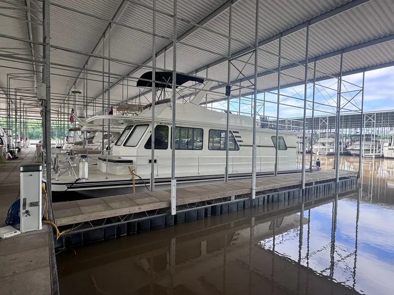Slide: The Image of 1994 Gibson 47 Executive yacht docked in covered marina. - 19