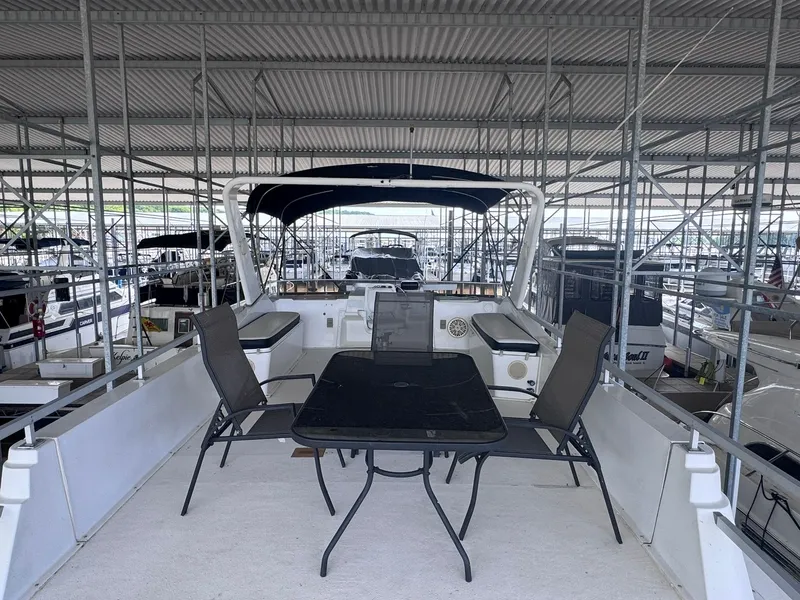 Slide: The Image of Gibson 47 Executive 1994 on a covered dock with seating area. - 20