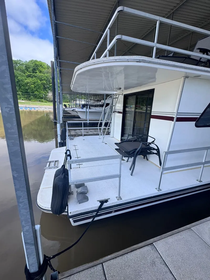 Slide: The Image of 1994 Gibson 47 Executive houseboat docked at marina. - 23