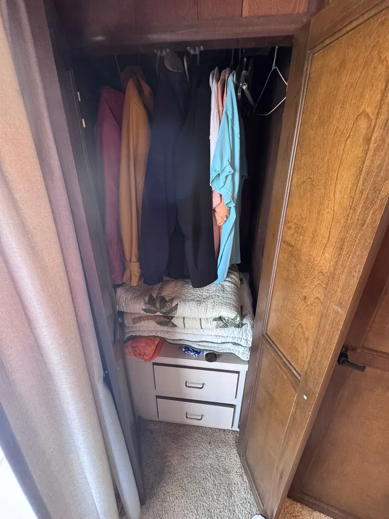 Slide: The Image of Closet in 1994 Gibson 47 Executive with clothes and blankets. - 28