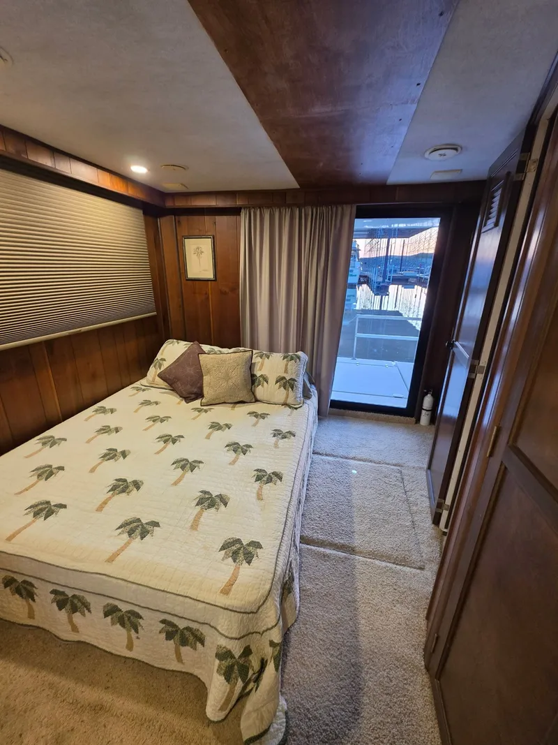 Slide: The Image of Bedroom in 1994 Gibson 47 Executive houseboat with palm tree bedding. - 3