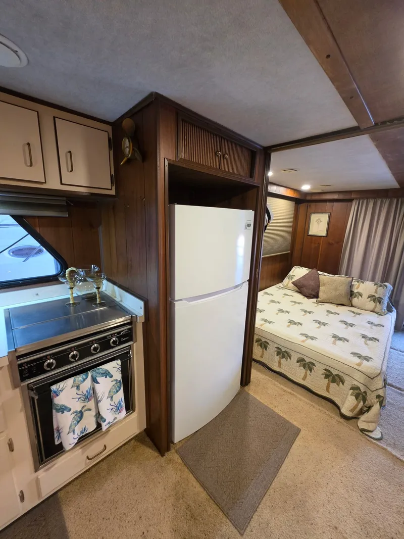 Slide: The Image of Interior of a 1994 Gibson 47 Executive with kitchen and bed. - 4