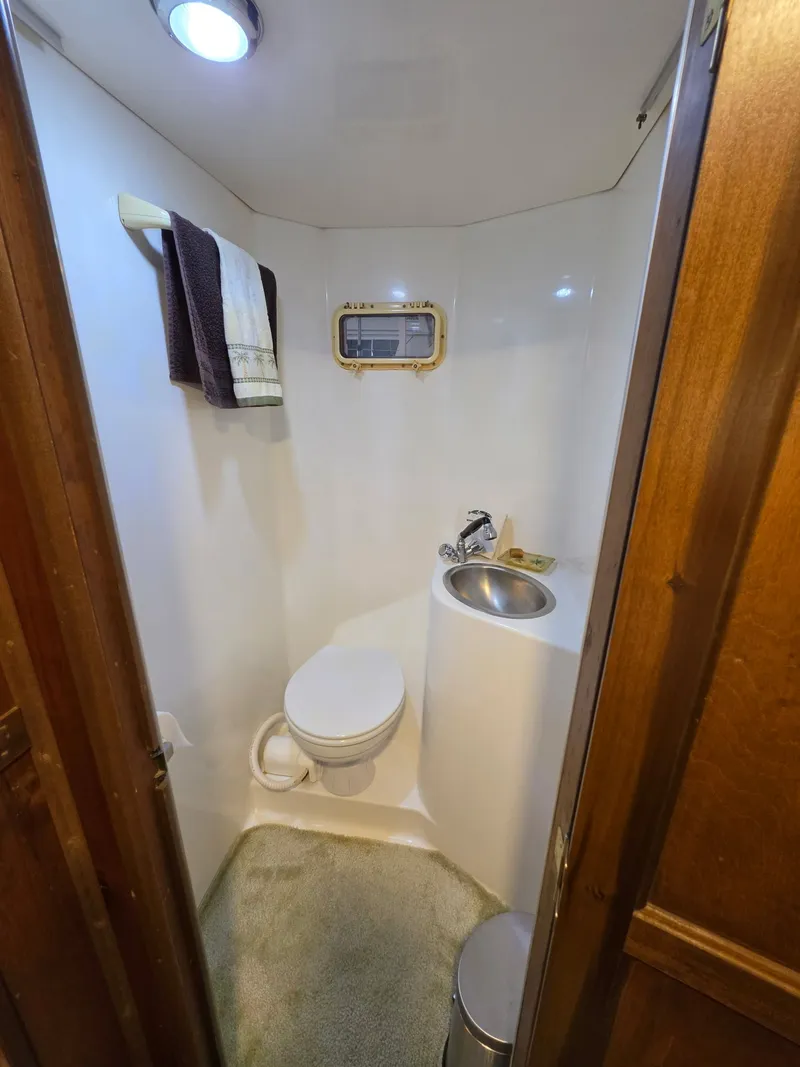 Slide: The Image of Compact bathroom in a 1994 Gibson 47 Executive boat. - 7