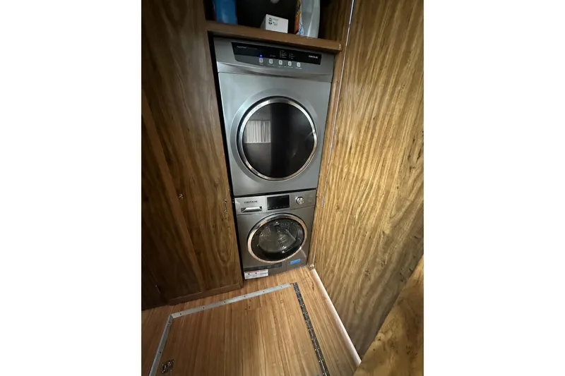 Slide: The Image of Stacked washer and dryer in a 1980 Lazy Days 14x59 houseboat interior. - 6