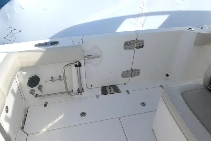 Slide: The Image of 2020 Boston Whaler 330 Outrage boat interior with seating and deck features. - 6