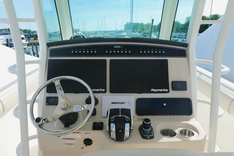 Slide: The Image of Control panel of a 2020 Boston Whaler 330 Outrage boat with Raymarine electronics. - 8