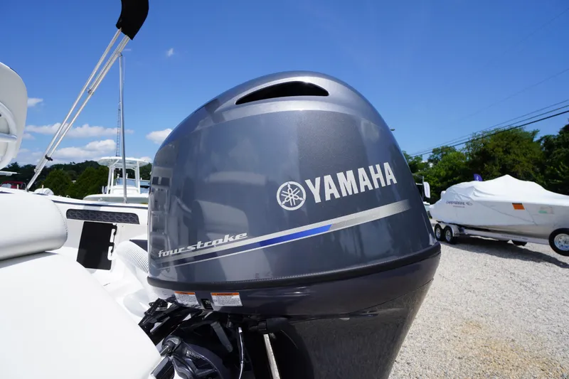 Slide: The Image of 2025 Tidewater 198 CC Adventure with Yamaha four-stroke engine, parked outdoors. - 41