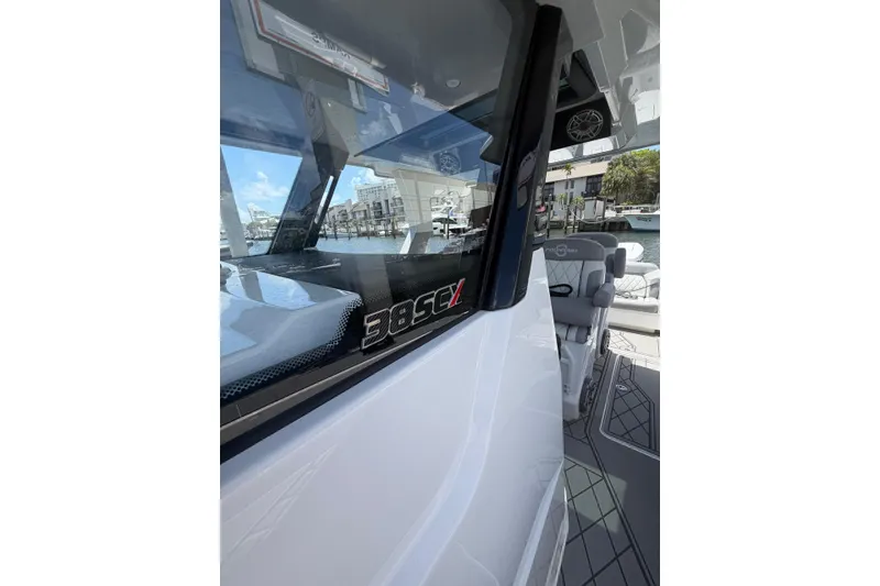 Slide: The Image of 2024 Fountain 38 SCX boat interior with sleek design and waterfront view. - 15