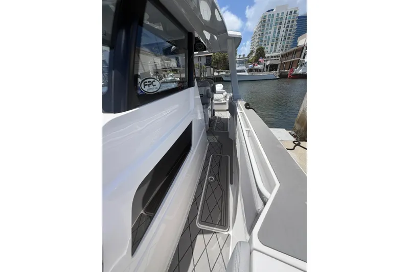 Slide: The Image of 2024 Fountain 38 SCX boat docked, showcasing sleek design and modern features. - 16