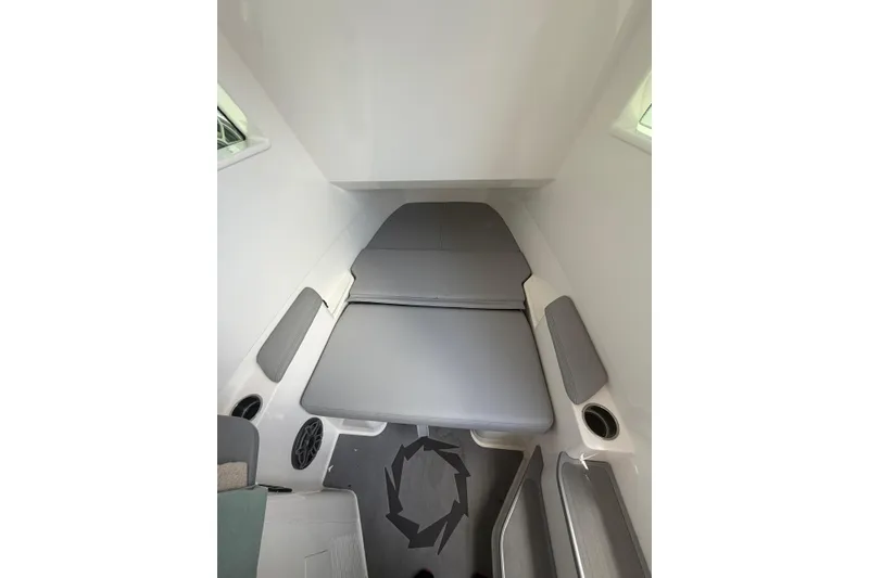 Slide: The Image of 2024 Fountain 38 SCX cabin interior with gray cushions and sleek design. - 28