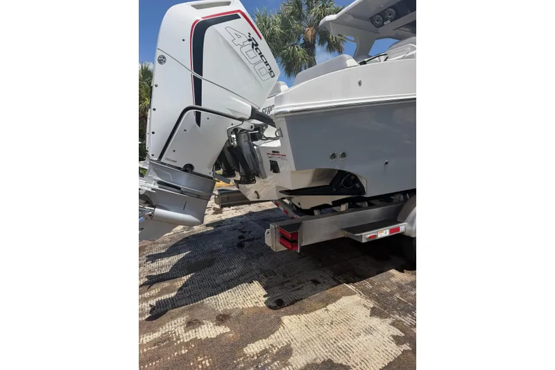 Slide: The Image of 2024 Fountain 38 SCX boat with powerful outboard motor on trailer. - 32