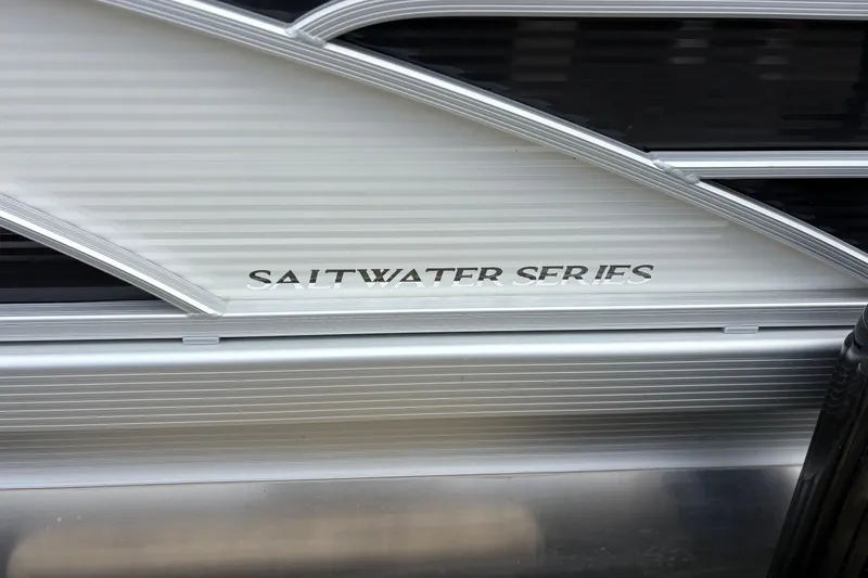 Slide: The Image of 2022 Bennington Saltwater Series boat exterior with sleek metallic design. - 7