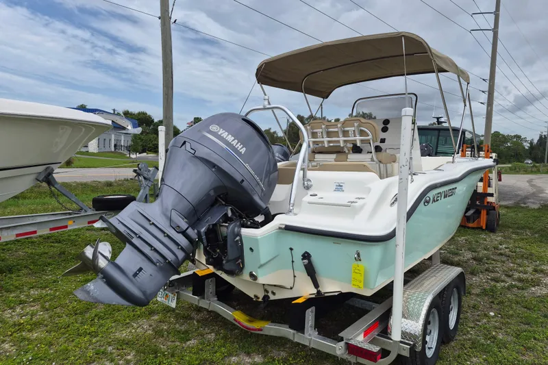 Slide: The Image of 2016 Key West 219 FS boat with Yamaha outboard engine on trailer. - 1