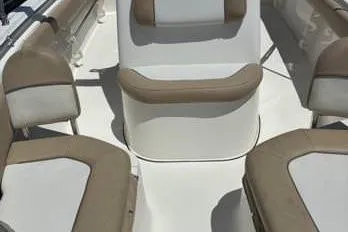 Slide: The Image of 2016 Key West 219 FS boat interior with beige and white seating arrangement. - 12
