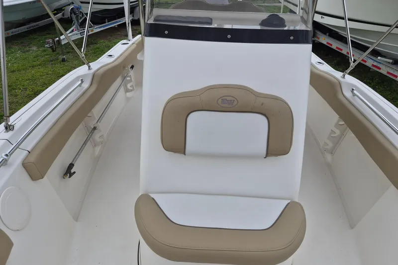 Slide: The Image of 2016 Key West 219 FS boat interior with beige and white seating. - 8