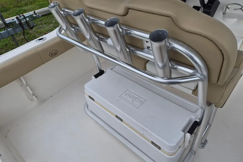 Slide: The Image of 2016 Key West 219 FS boat interior with rod holders and cooler storage. - 9