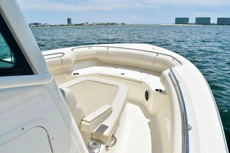 Slide: The Image of 2023 Boston Whaler 280 Outrage boat with spacious seating on calm waters. - 10