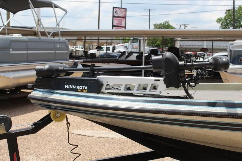 Slide: The Image of 2006 Skeeter SX200 boat with Minn Kota Ultrex trolling motor in a dealership lot. - 12