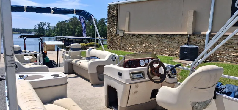 Slide: The Image of 2006 Tracker 24 ft Pontoon at dock with interior view. - 7
