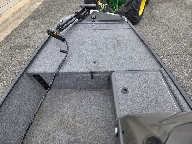 Slide: The Image of 2024 Tracker Bass Tracker Classic XL boat deck with gray carpet. - 6