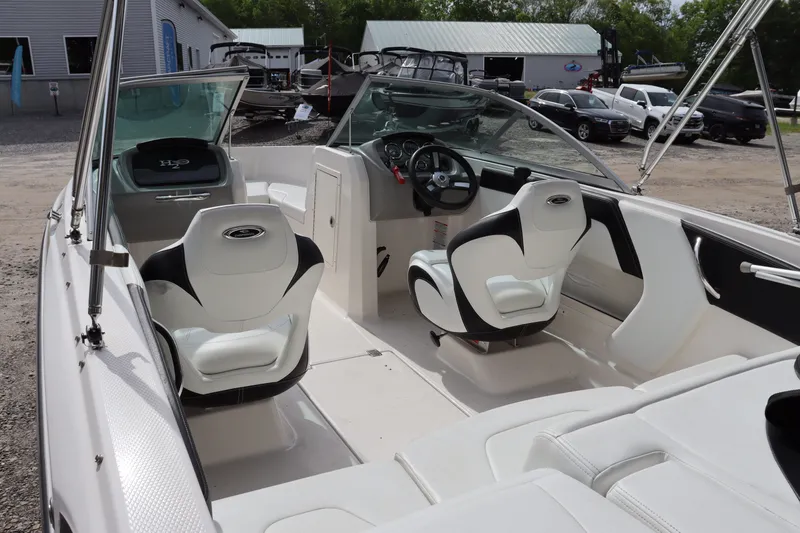 Slide: The Image of Interior of a 2019 Chaparral 19 H2O boat, white seats, modern design. - 17