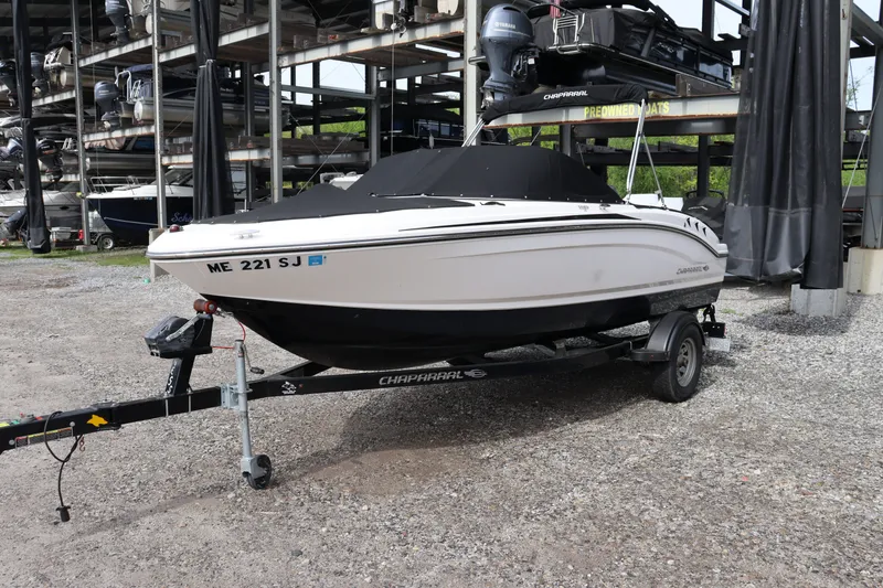 Slide: The Image of 2019 Chaparral 19 H2O boat on trailer outdoors. - 18