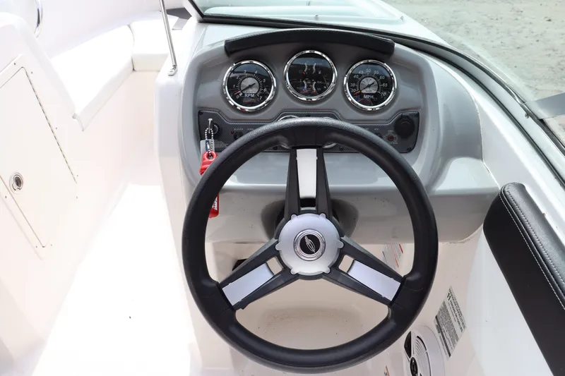 Slide: The Image of Steering wheel and dashboard of a 2019 Chaparral 19 H2O boat. - 6