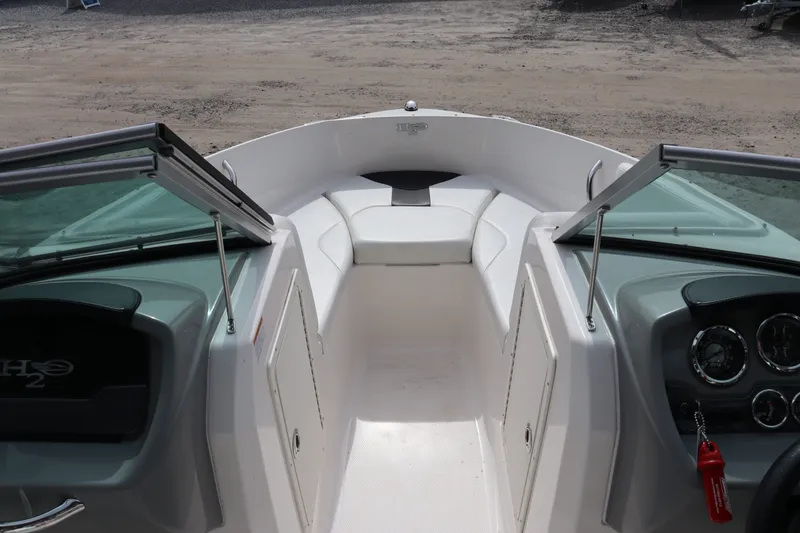 Slide: The Image of Interior view of a 2019 Chaparral 19 H2O boat with open windshield. - 8