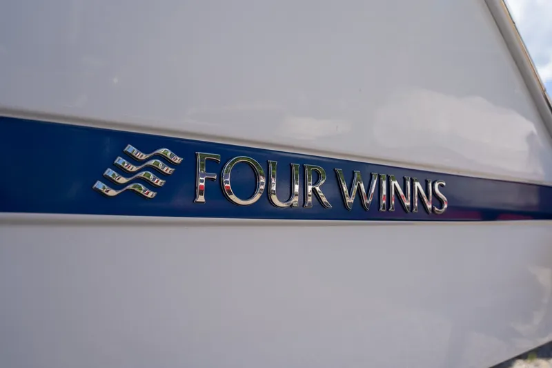 Slide: The Image of Close-up of Four Winns HD1 LX 2021 logo on blue stripe. - 2