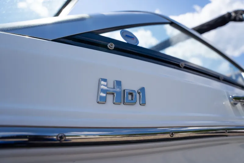 Slide: The Image of Close-up of Four Winns HD1 LX boat emblem, 2021 model. - 3