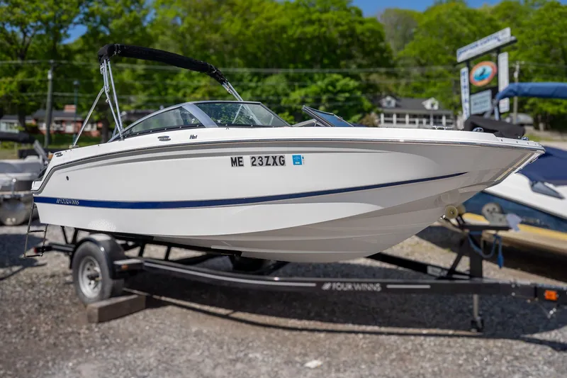 Slide: The Image of 2021 Four Winns HD1 LX boat on trailer outdoors. - 4