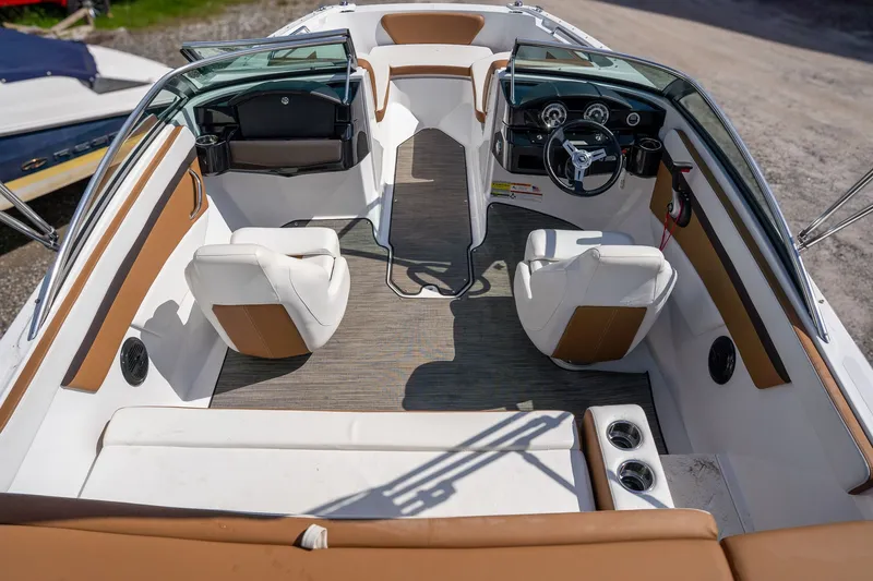 Slide: The Image of Interior of 2021 Four Winns HD1 LX boat with white and brown seating. - 6