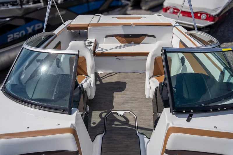 Slide: The Image of Interior of a 2021 Four Winns HD1 LX boat with brown and white seating. - 8