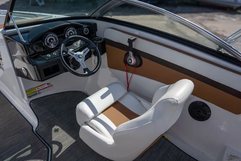 Slide: The Image of Interior of 2021 Four Winns HD1 LX with steering console. - 9