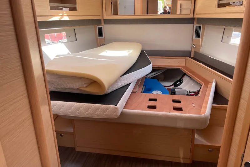 Slide: The Image of Interior cabin of 2022 Dufour 530 yacht with storage under bed. - 19